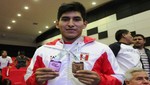 Juegos Bolivarianos 2013: Pesista peruano consigue medalla de bronce